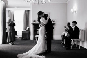 Black-and-white portrait of bride and groom at registry office