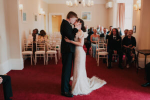 First kiss of bride and groom at Newport Registry Office
