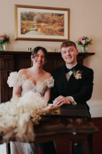 Bride and groom smiling at Newport Registry Office