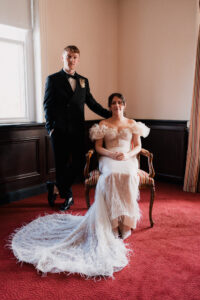 Formal portrait of bride and groom at registry office
