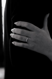 Black-and-white close-up shot of bride's wedding band