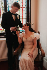Bride and groom sharing non-alcoholic drinks at registry office