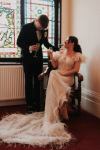 Candid portrait of bride and groom laughing