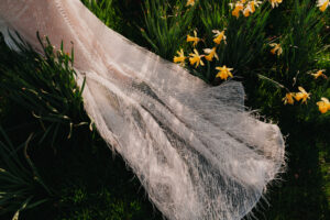Close-up detail of the bride's dress at Tredegar House