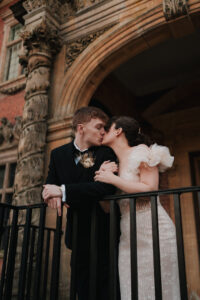Bride and groom kissing at Tredegar House, Newport