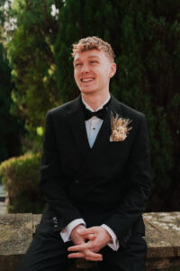 Candid portrait of groom smiling in South Wales