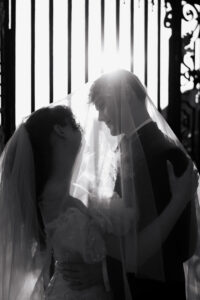 Couple guided into a pose within the manor grounds