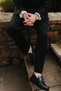Portrait of details of the groom's wedding attire