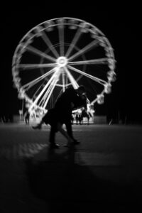 Black-and-white portrait of couple with motion blur in Cardiff Bay