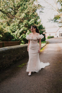 Bride walking to first look with groom at Ramada Resort