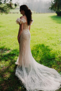 Back of bride's dress in soft light at Wyndham Cwrt Bleddyn