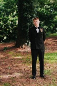 Portrait of the groom being shocked by bride at first look