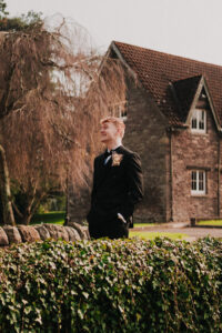 Groom laughing in portrait at the Ramada Resort