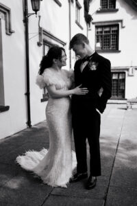 Bride and groom laughing, candid moment, black-and-white