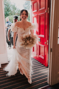Bride smiling at guests in Newport Registry Office