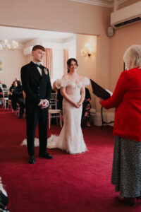 Bride and groom at the front of the ceremony in the registry office