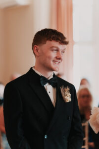 Candid portrait of groom at registry office