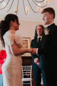 Father of the groom smiling at the bride