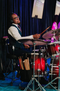 Candid photo of the drummer in wedding ceremony