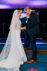 Bride and groom praying before ceremony at Jubilee Church