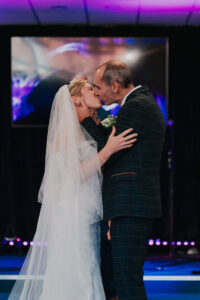 Bride and groom's first kiss as a married couple