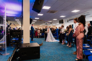 Wide photo of the congregation during wedding ceremony