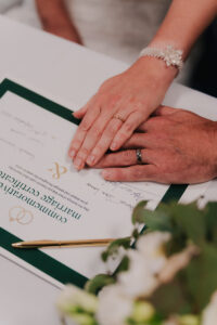 Close up of wedding bands on the marriage certificate