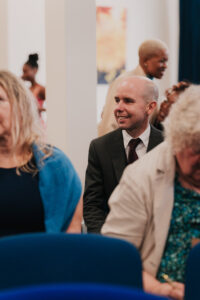 Guest smiling at wedding in Grantham, Lincolnshire