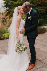 Bride and groom kissing during portrait session