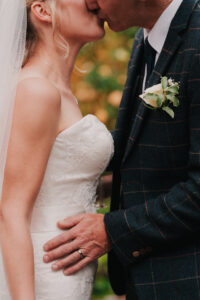 Bride and groom kissing during portrait session