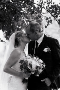 Bride and groom kissing during portrait session