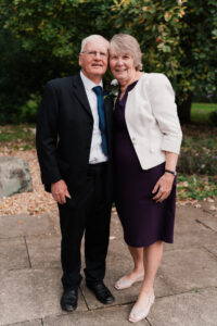 Wedding portrait of father and mother of the bride in Wyndham Park, Grantham