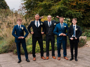 Silly wedding group photo of groomsmen