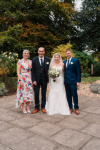 Formal wedding group photo in Wyndham Park, Grantham