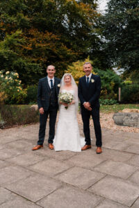 Wedding portrait of bride, groom, and best man in Grantham
