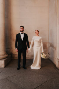 Formal wedding portrait of the bride and groom at Cardiff Museum