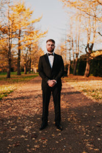 Groom holding a guided pose at Bute Park