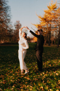 Playful blurred motion shot of the couple dancing in Bute Park