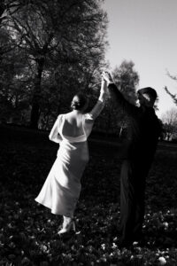 Black-and-white photo of bride and groom dancing