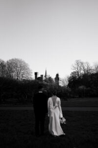 Directed portrait of the couple near Cardiff Castle in black-and-white