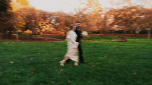 Bride and groom running together, motion blur shot