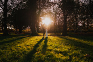 Wide angle portrait of sunset on bride and groom in Cardiff