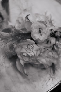 Detail shot of the wedding rings within the bride's bouquet