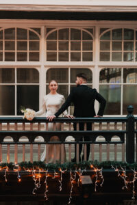 Portrait of the groom facing away from the bride as she looks in the opposite direction in Morgan Arcade