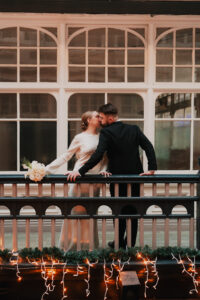 Bride and groom share a kiss in Morgan Arcade