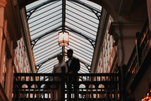 Silhouetted portrait of bride and groom in Morgan Arcade