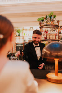 Groom serving from the bar