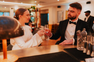 Bride and groom sharing a drink at the bar at the Cardiff Townhouse