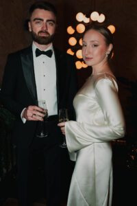 Bride and groom pose for formal portrait