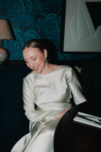 Candid moment of bride laughing, direct flash portrait